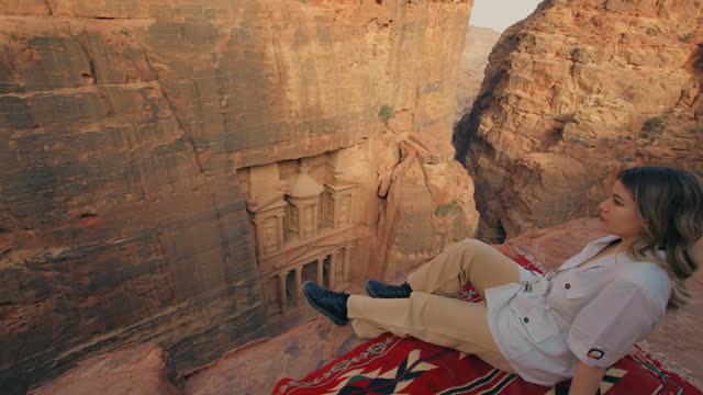 Blond Woman on a red carpet looking at Petra