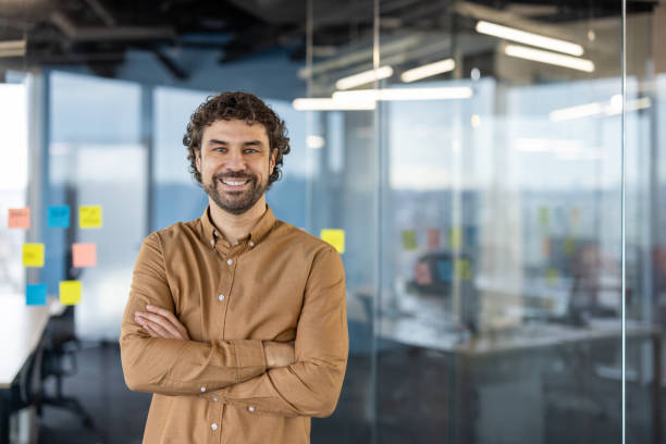 istock Smiling Hispanic businessman in casual office setting 2148465629