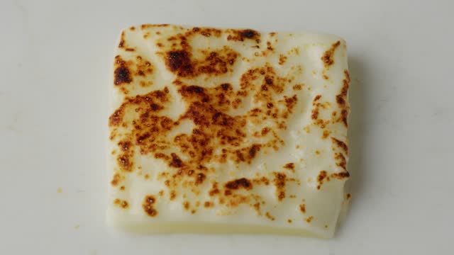 Burnt slice of mozzarella cheese