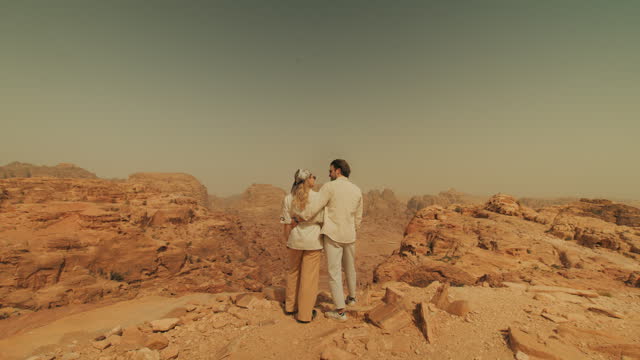 Tourists Travelling through Arabian Desert in Jordan and expressing love