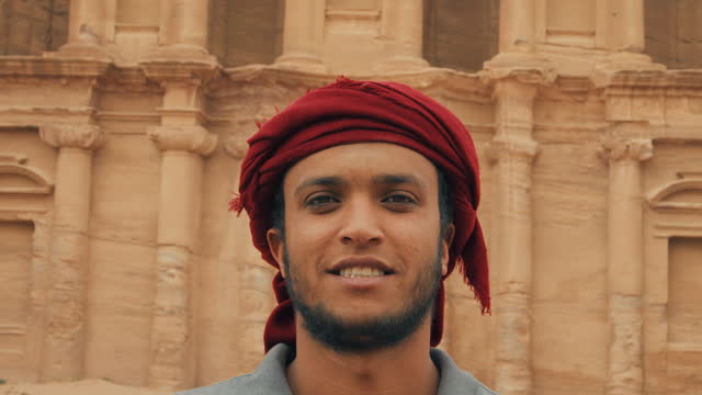 Man with Keffiyeh Looking At Camera in front of Petra