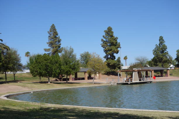 Picnic ramada and water side docking pier gazebo at lake Kiwanis park in Tempe, Arizona