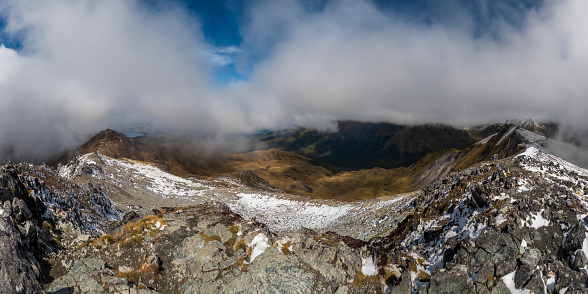 Kepler Track Panorama: Snow-Capped Mount Luxmore Landscape with Tussock-Covered Peaks in Fiordland National Park, New Zealand