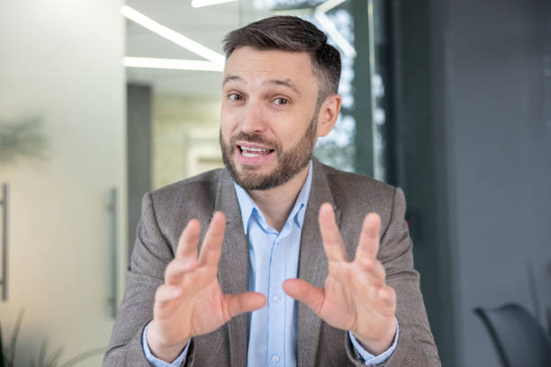 istock Businessman talking during a video call in office 2148469271
