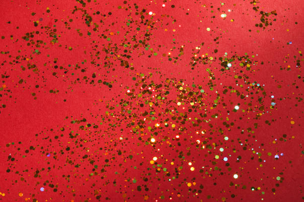 istock Red background with golden glitter spread - shiny holiday background texture 2148469587