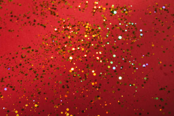 istock Red background with golden glitter spread - shiny holiday background texture 2148470302