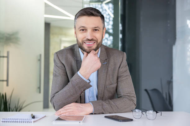 istock Businessman smiling during a video call at the office 2148470572