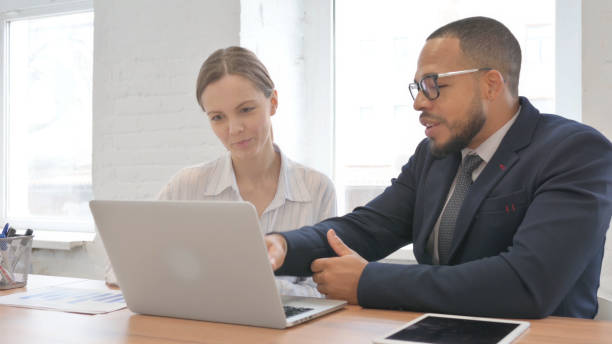 istock Businessman Talking with Male Worker in Office 2148470805