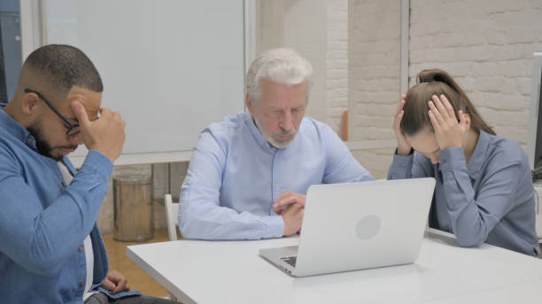 istock Shocked People Reacting to Failure on Laptop 2148471226