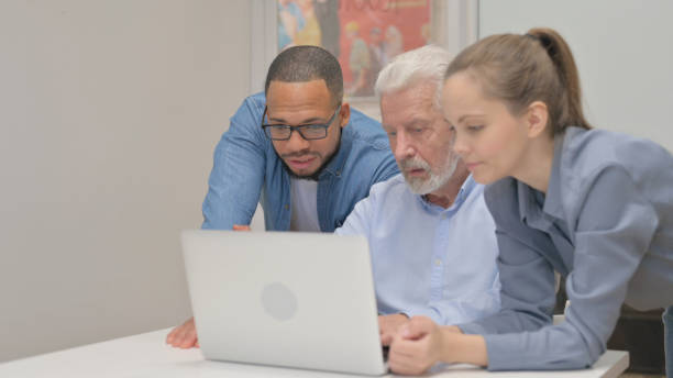 istock Close up of Multiracial Team Working on Laptop 2148471764
