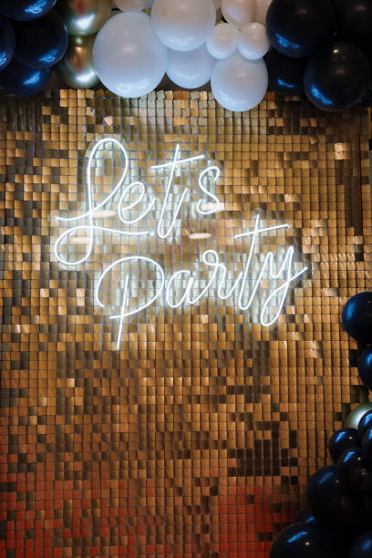 istock Lets party inscription on the glitter wall. Holiday decor. 2148472040