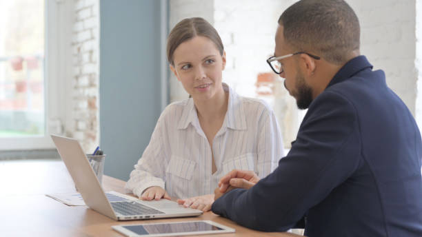istock Businesswoman Discussing Work with Business Partner 2148472050