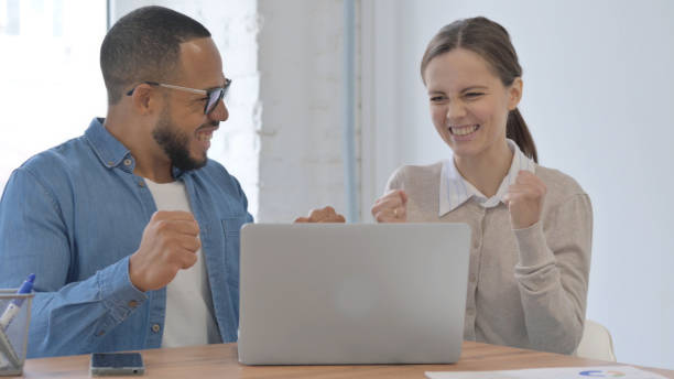 istock Excited Multi Ethnic Casual People Celebrating Success at Work 2148472455
