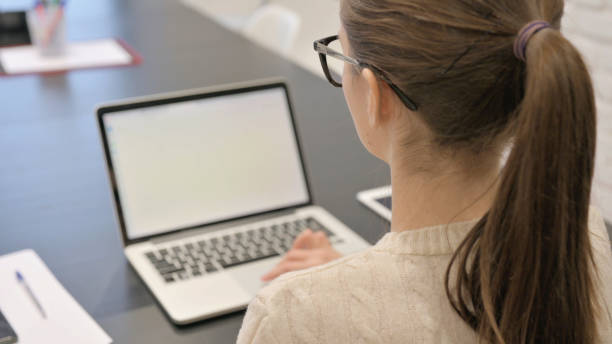istock Woman Working on Laptop in Office 2148472918
