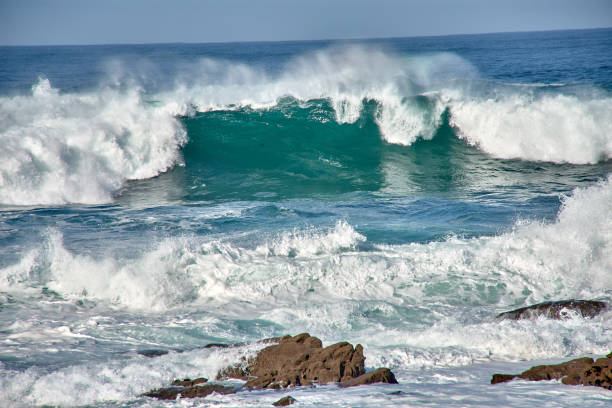 istock Large waves breaking at the Baiona Breakwater, Pontevedra, Spain 2148473948