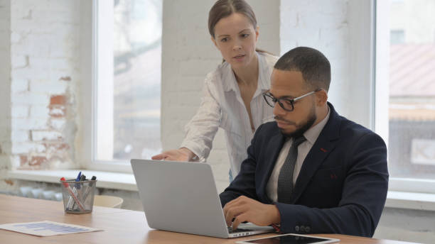 istock Angry Businesswoman Talking with Businessman at Work 2148474193
