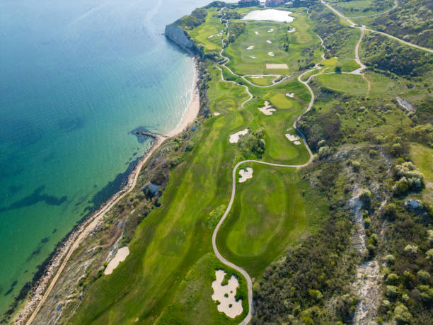 istock Aerial View of Golf Course Adjacent to Sea 2148474544