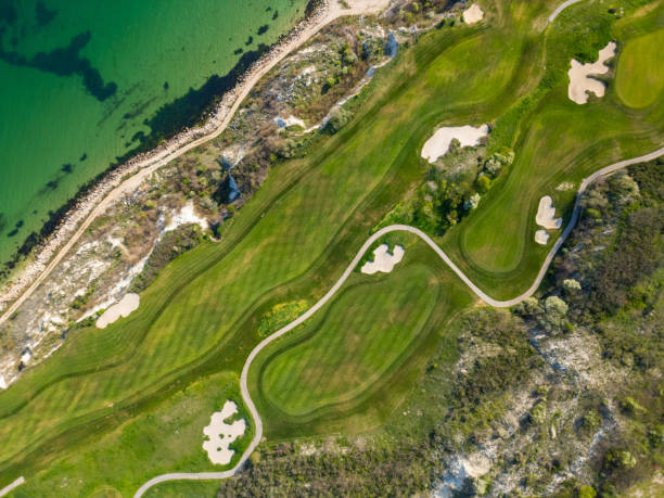 istock Aerial View of Golf Course Adjacent to Sea 2148474547