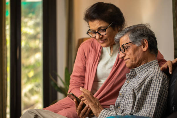 istock Senior couple using social media over cellphone at home 2148475594