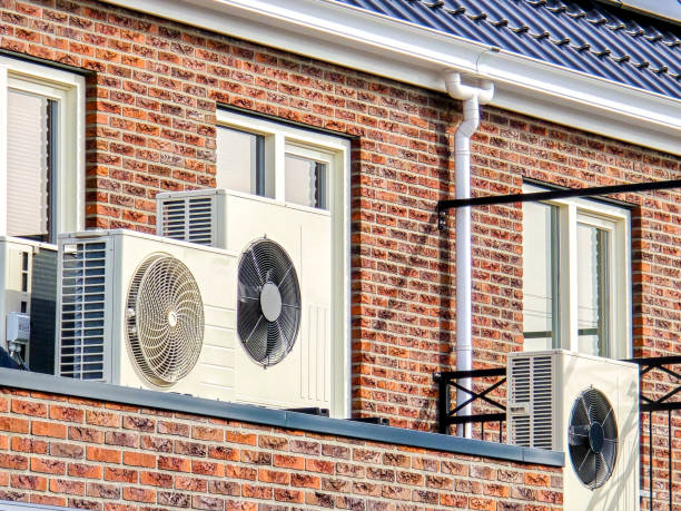 istock air source heat pump unit installed outdoors at a modern home with solar panels in the Netherlands 2148476396
