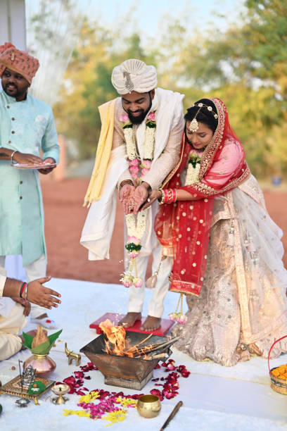 istock Couple performing Havan rituals during the Hindu wedding ceremony 2148476722