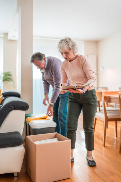 istock Elderly Couple Engaged in Home Recycling Activities 2148478149