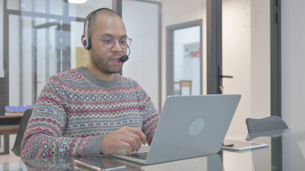 istock Call Center Employee with Headset Talking with customer Online 2148478845