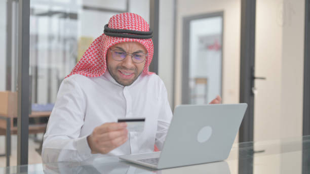 istock Online Banking Failure for Young Arab Man, Credit Card 2148479161