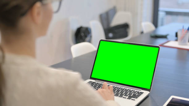 istock Woman Using Laptop with Green Screen 2148479838