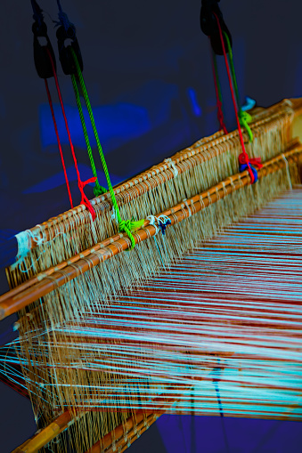 Cotton fibers on a local loom at Nan Province, Thailand. Local textile work of the northern region in Thailand.