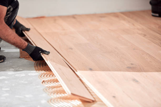 istock Professional handyman installing laminate flooring in a new apartment. 2148484537