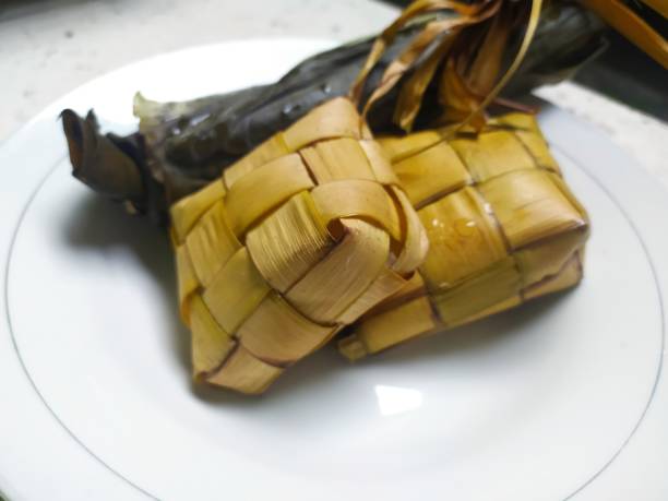 istock ketupat and lontong served on a white plate 2148484971