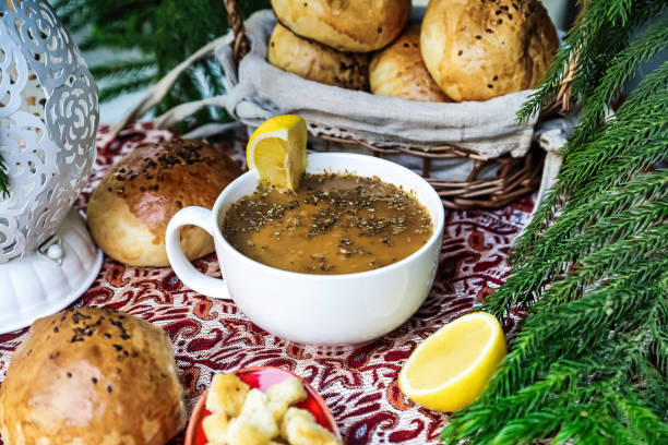A table adorned with fresh bread and a steaming bowl of soup, ready to be enjoyed.