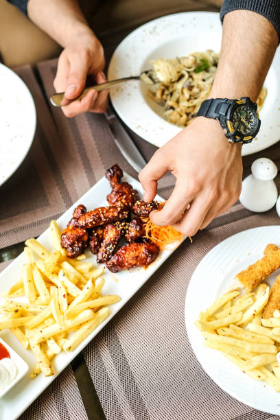 istock Person Cutting Food on Plate With Knife 2148485172