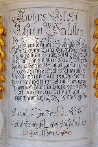 Handcarved antique letters on Pest column in Eisenstadt, Burgenland, Austria, ereceted in 1713 on market square