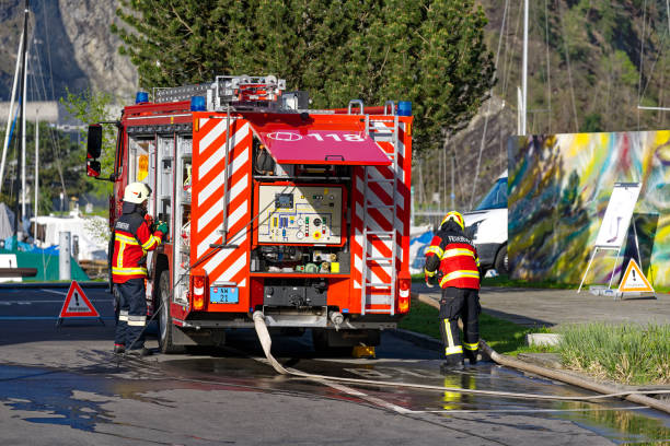Firefighters doing exercise at Swiss village of Stansstad on a sunny sprig morning. Photo taken April 11th, 2024, Stansstad, Switzerland.