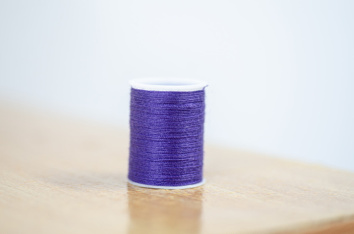 Color Yarn on brown table.