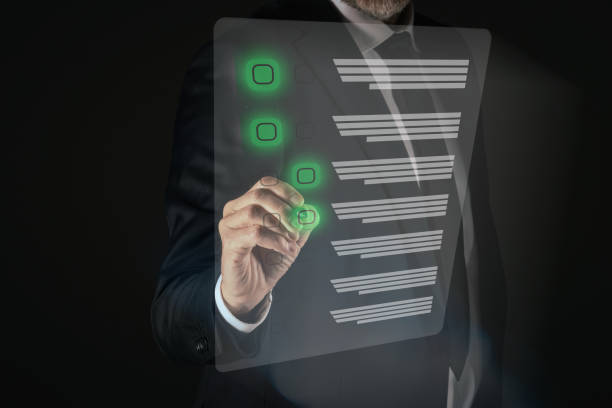istock Man do online exam on virtual screen. Answer a survey filling out a tech form. Quiz, test concept 2148492572