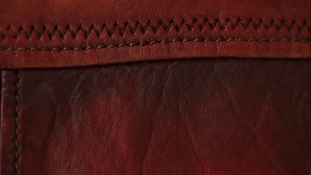 Red leather jacket as a background close-up, leather