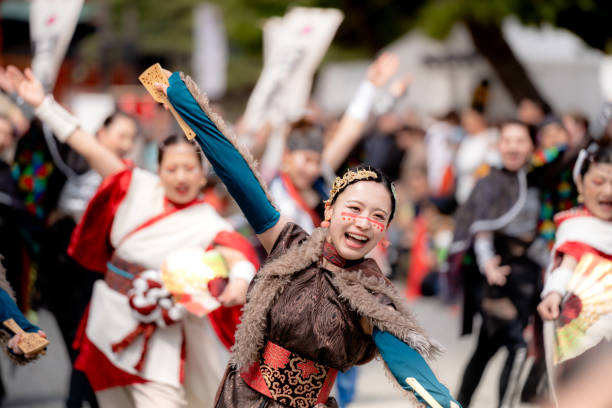 Kyoto, Japan - March 31 2024 : Kyoto Sakura Yosakoi ( Sakuyosa ) festival. A group of dancers dancing down a street at the Okazaki area around Heian Shrine.