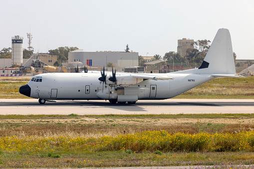 Luqa, Malta - April 13, 2024: Pallas Aviation Lockheed Martin LM-100J Hercules (L-382) (Reg.: N67AU) landing in crosswind runway 13.