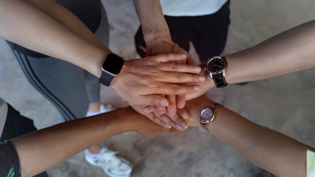istock Teamwork Concept,Group of diversity people to greeting power tag team,Teamwork Join Hands Partnership Concept of people putting their hands together,Friends with hands showing unity. 2148497633