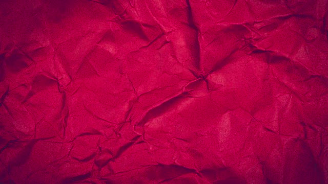 Stop motion animated paper texture background. Crumpled Red Paper Looping Animation in 4k