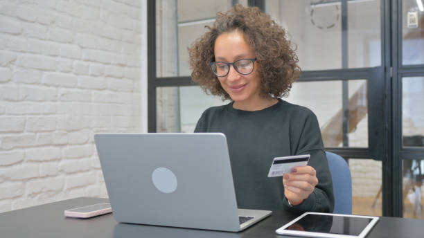 istock Hispanic Woman Doing Online Payment at Work 2148498673