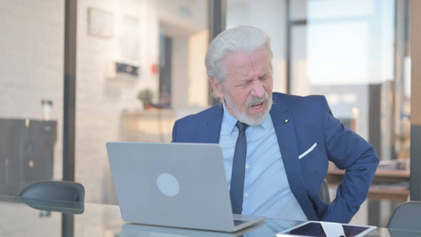 istock Old Businessman having Back Pain in Office 2148498955