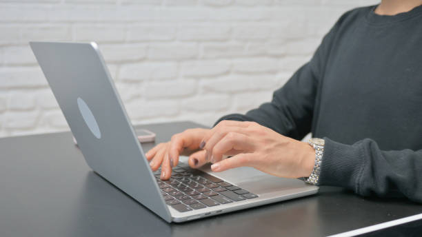 istock Close up Female Hands Typing on Laptop 2148499897