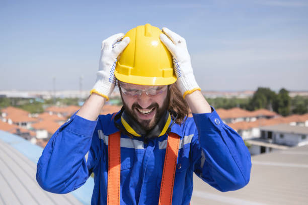 istock Stressed engineer grab his head suffer from acrophobia while working on the factory rooftop 2148500087