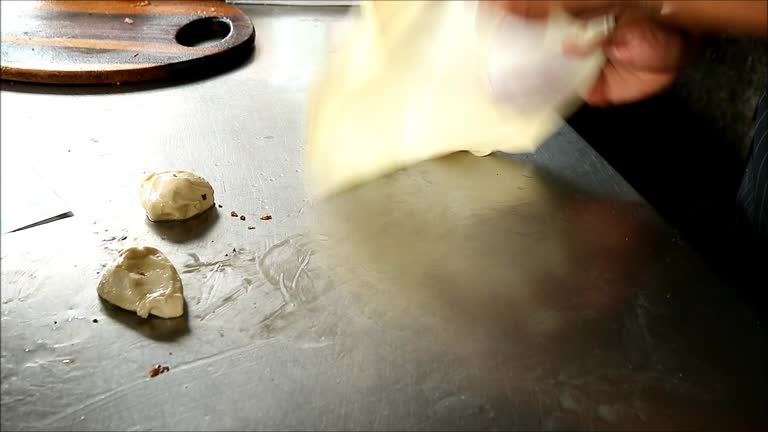 Footage of Chef Kneading Roti Dough in the Kitchen