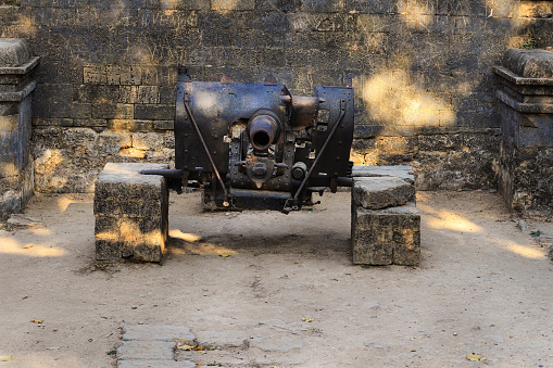 Vintage Cannon five hundred year old Portuguese Guns, made of steel, rusting away at the Diu Fort, an erstwhile Portuguese Colony in India. old cannon in the defense of the Diu port