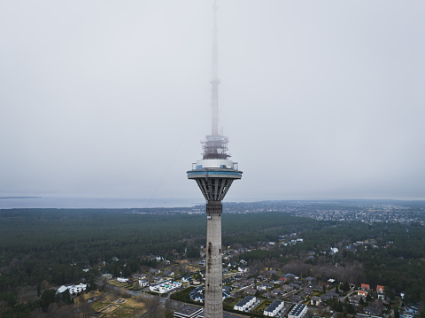 Tallinn TV tower in the fog, photo from above from a drone. Close up.